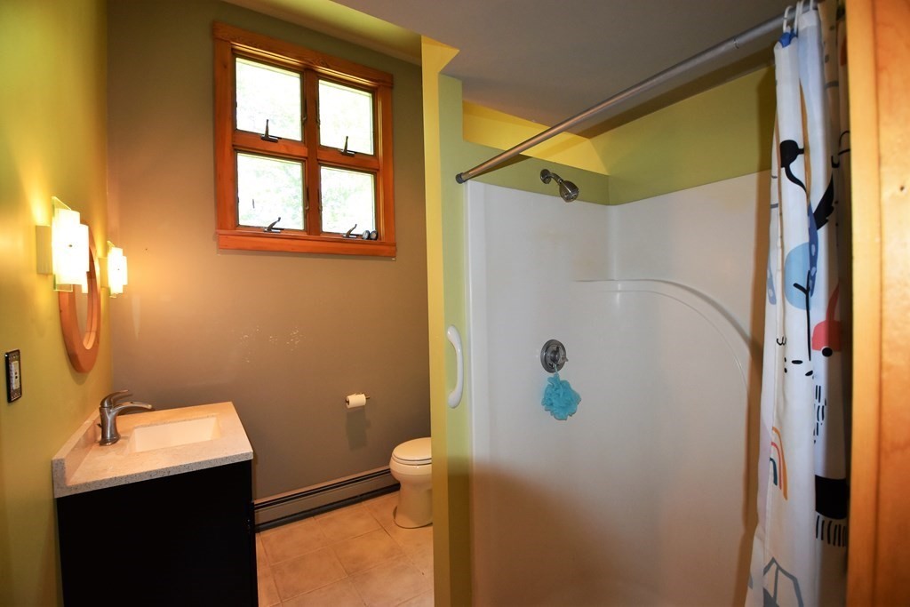 20 Amherst Road Hopkinton, MA 01748 - Photo 20 of 27 a bathroom with a shower and a sink