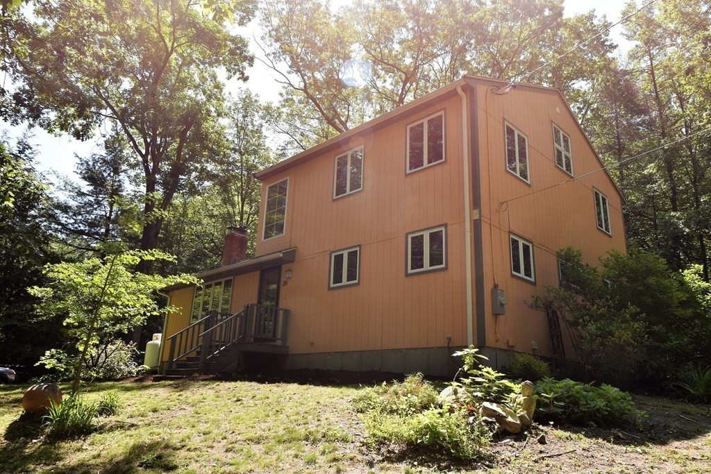 20 Amherst Road Hopkinton, MA 01748 - Photo 22 of 27 a front view of house with yard