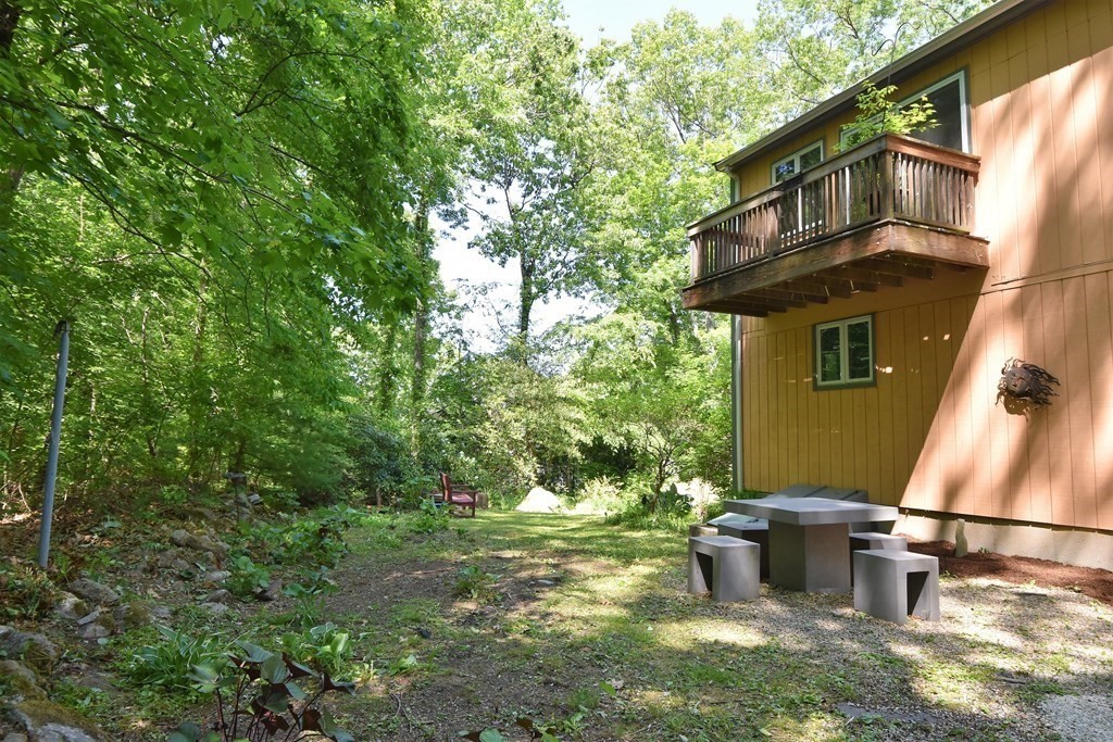 20 Amherst Road Hopkinton, MA 01748 - Photo 23 of 27 a backyard of a house with lots of green space