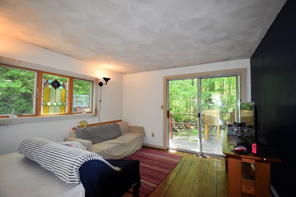 20 Amherst Road Hopkinton, MA 01748 - Photo 6 of 27 a living room with furniture and a floor to ceiling window