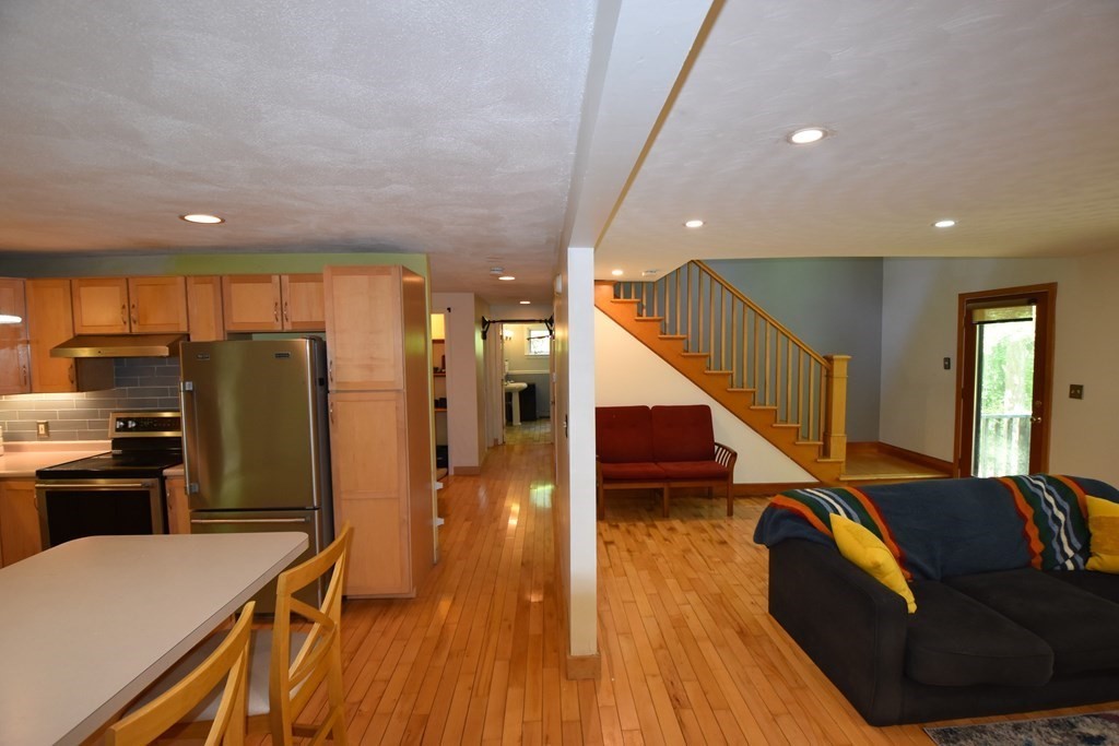 20 Amherst Road Hopkinton, MA 01748 - Photo 8 of 27 a living room with lots of furniture and wooden floor