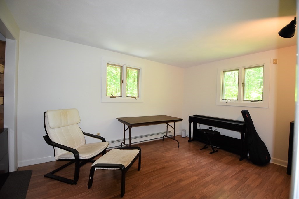 20 Amherst Road Hopkinton, MA 01748 - Photo 10 of 27 a view of a livingroom with furniture and a window