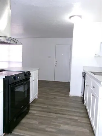 a kitchen with a stove and a microwave
