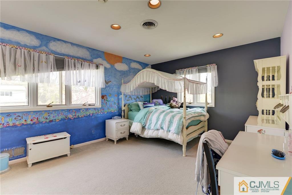 77 Rolling Hills Road Clifton, NJ 07013 - Photo 12 of 16 a bedroom with two beds and a window