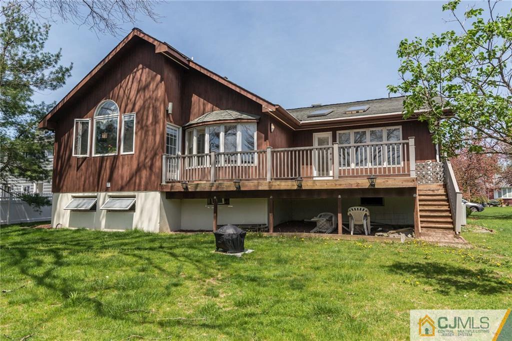 77 Rolling Hills Road Clifton, NJ 07013 - Photo 16 of 16 a front view of a house with a yard