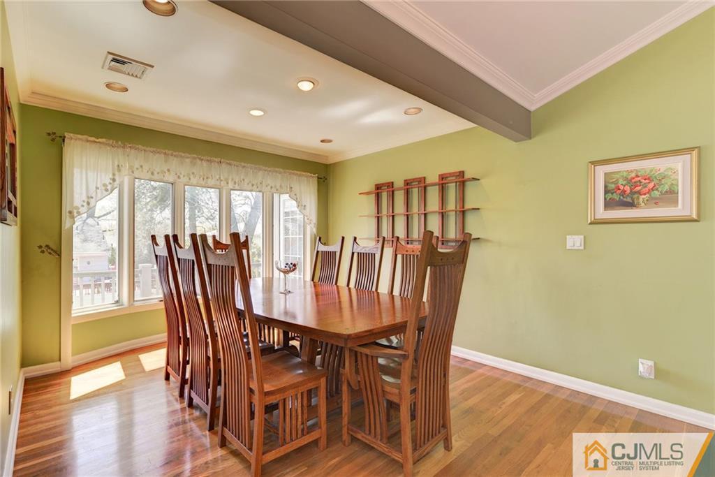 77 Rolling Hills Road Clifton, NJ 07013 - Photo 6 of 16 a view of a dining room with furniture and wooden floor