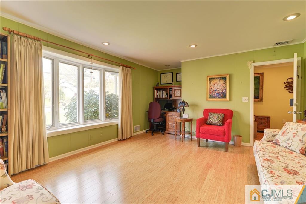 77 Rolling Hills Road Clifton, NJ 07013 - Photo 7 of 16 a bedroom with furniture and a large window