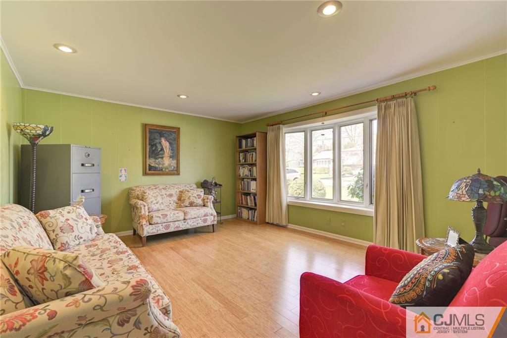 77 Rolling Hills Road Clifton, NJ 07013 - Photo 8 of 16 a bedroom with furniture and a couch