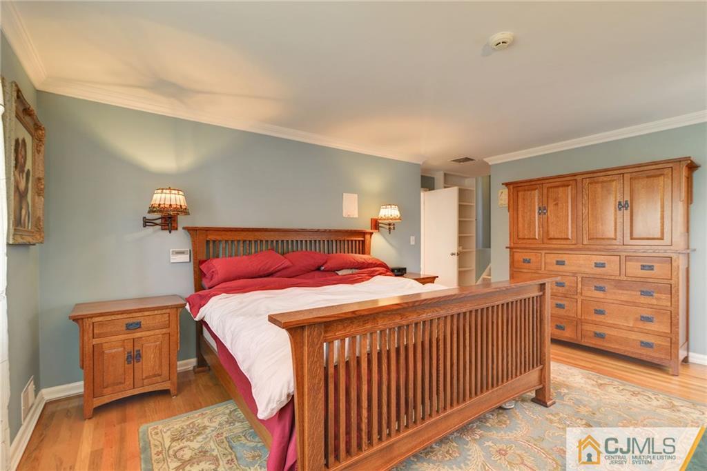 77 Rolling Hills Road Clifton, NJ 07013 - Photo 10 of 16 a bedroom with a bed and a dresser