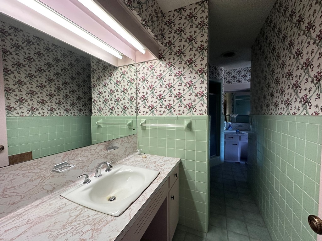 180 Griesenbeck Ranch Road Bastrop, TX 78602 - Photo 12 of 19 a bathroom with a sink and vanity