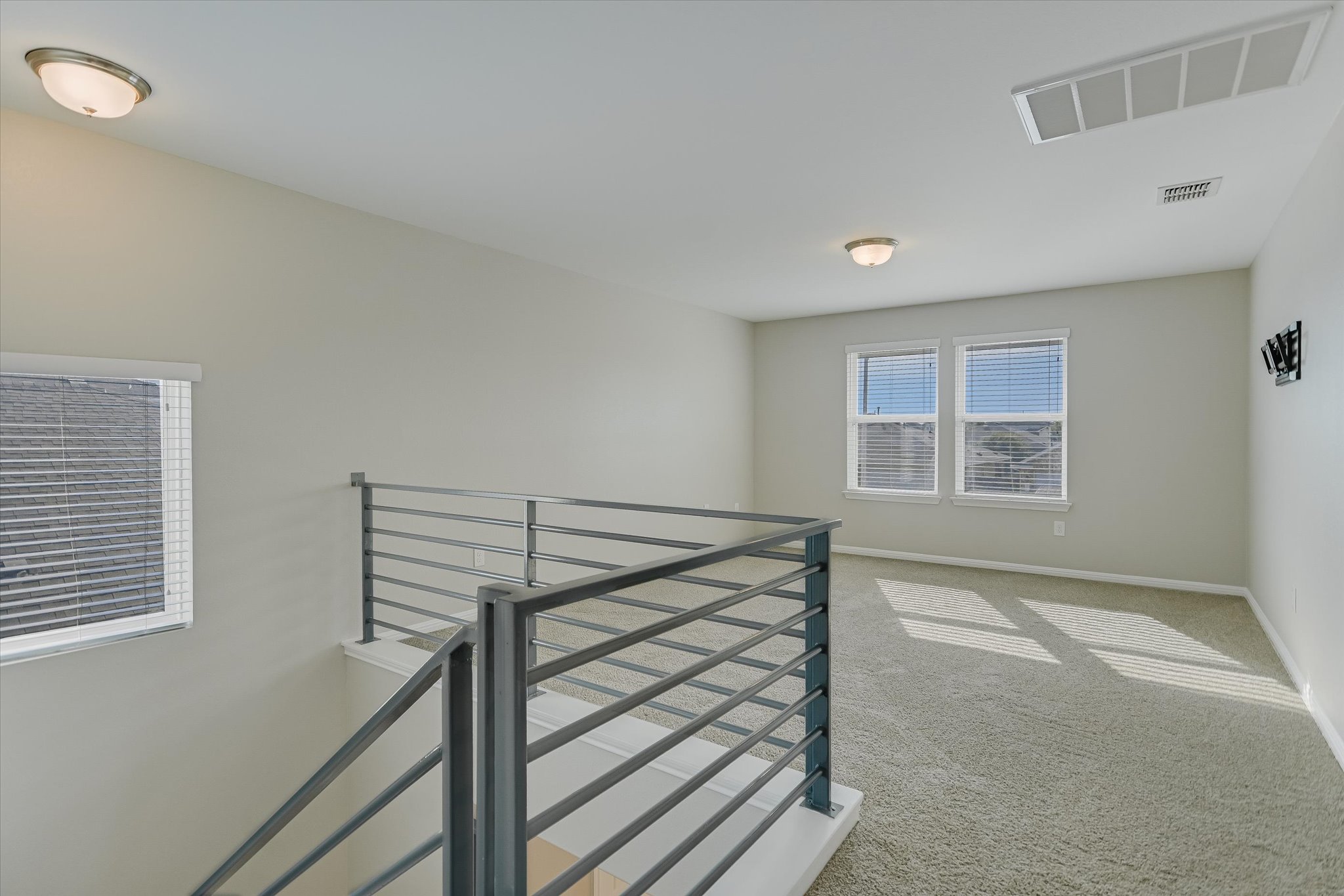 10317 Laurie Lane Austin, TX 78747 - Photo 13 of 27 An oversized upstairs game room provides flexible bonus space for a media room, home office, gym, or second living area.
