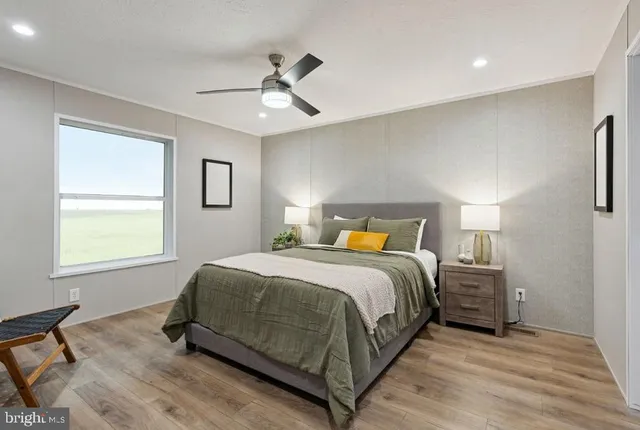 a bedroom with a bed and a chair