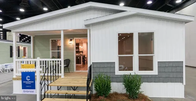 a kitchen with granite countertop a sink stainless steel appliances and cabinets