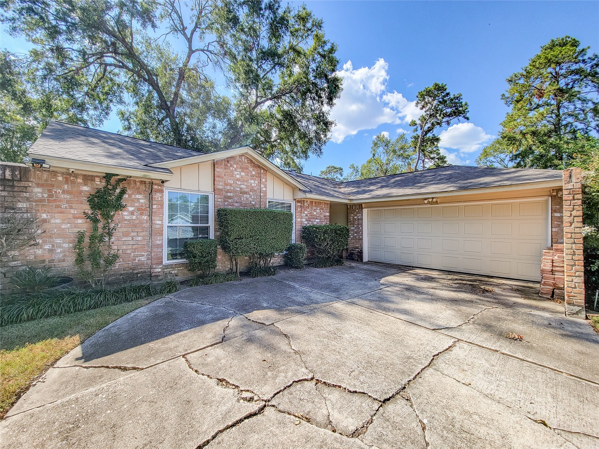 5414 Sweetwind Lane Spring, TX 77373 - Photo 1 of 30 a view of a house with a yard and potted plants
