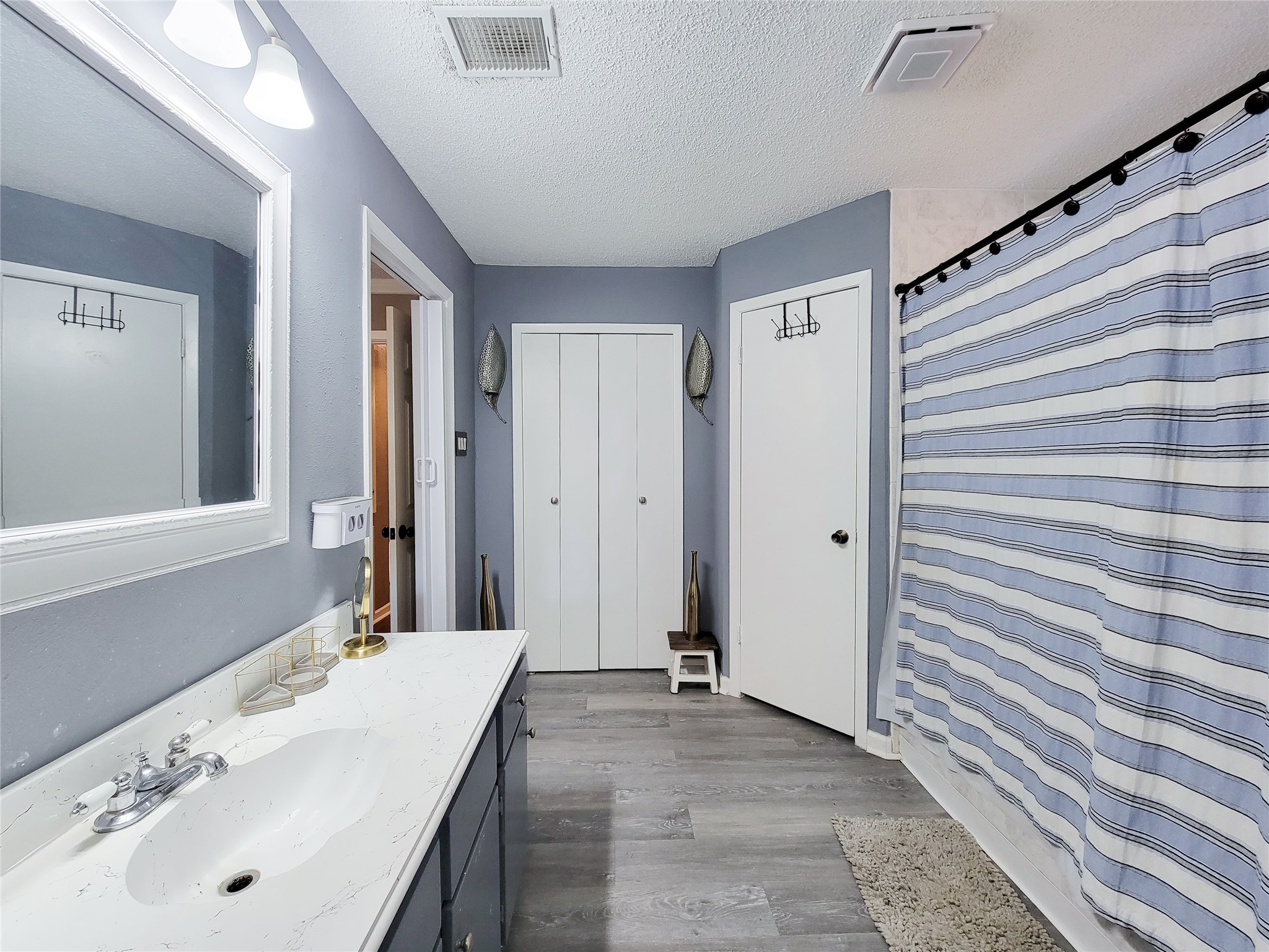 5414 Sweetwind Lane Spring, TX 77373 - Photo 13 of 30 a bathroom with a sink and a mirror