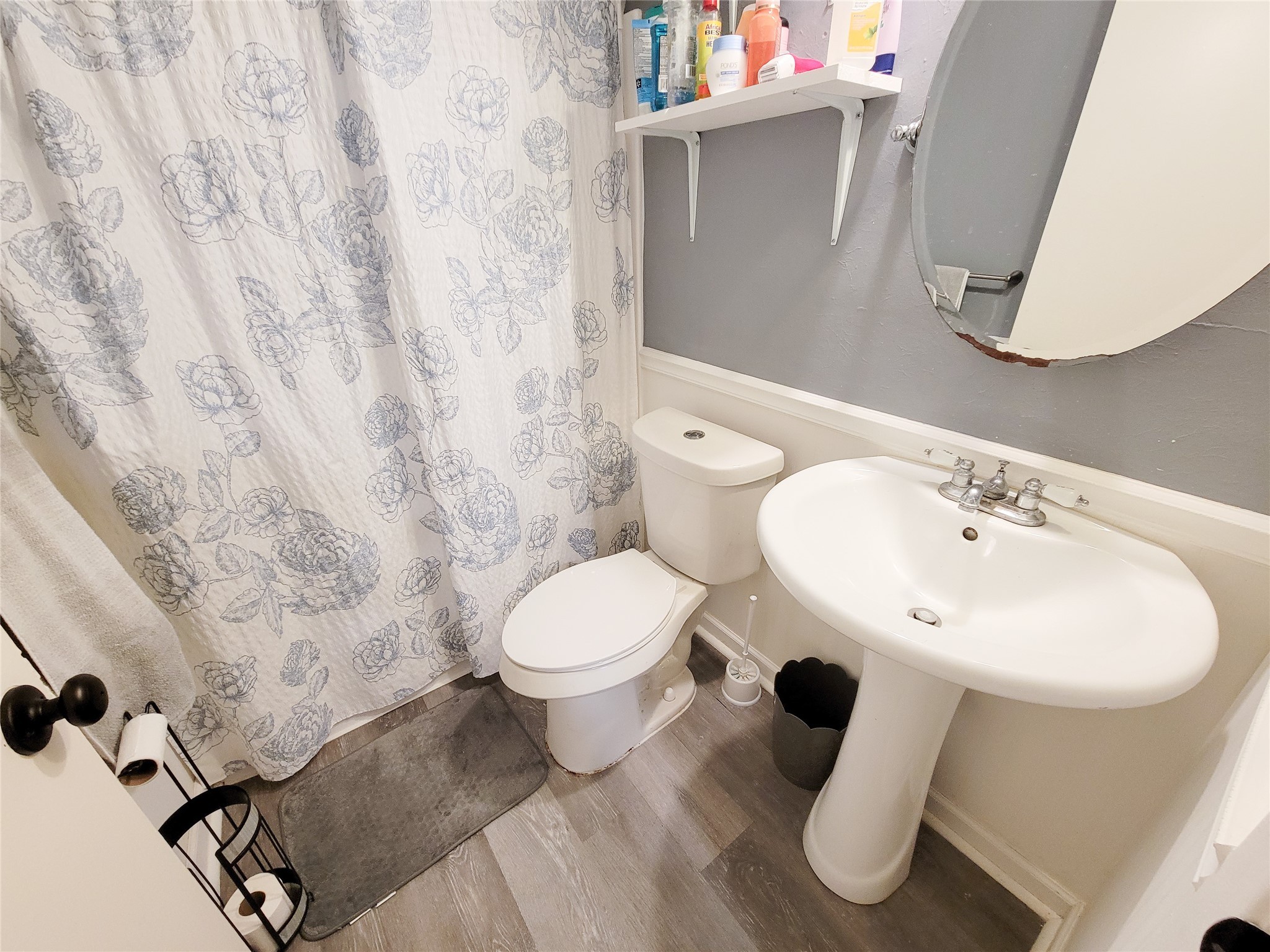 5414 Sweetwind Lane Spring, TX 77373 - Photo 14 of 30 a bathroom with a toilet sink and mirror