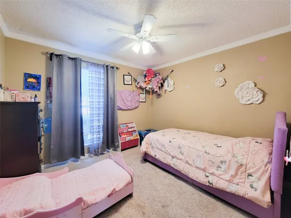 a bedroom with bed and cabinets