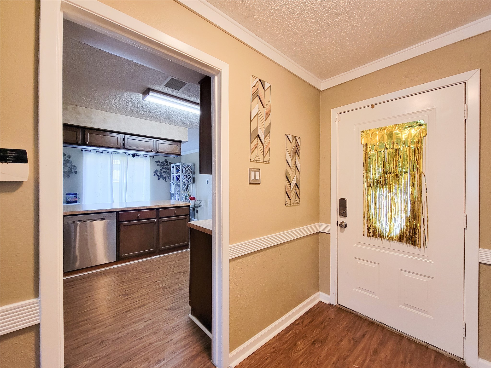 5414 Sweetwind Lane Spring, TX 77373 - Photo 18 of 30 a view of walk in closet with wooden floor and furniture