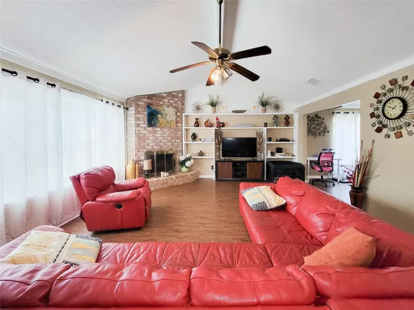 a bedroom with furniture and a fireplace