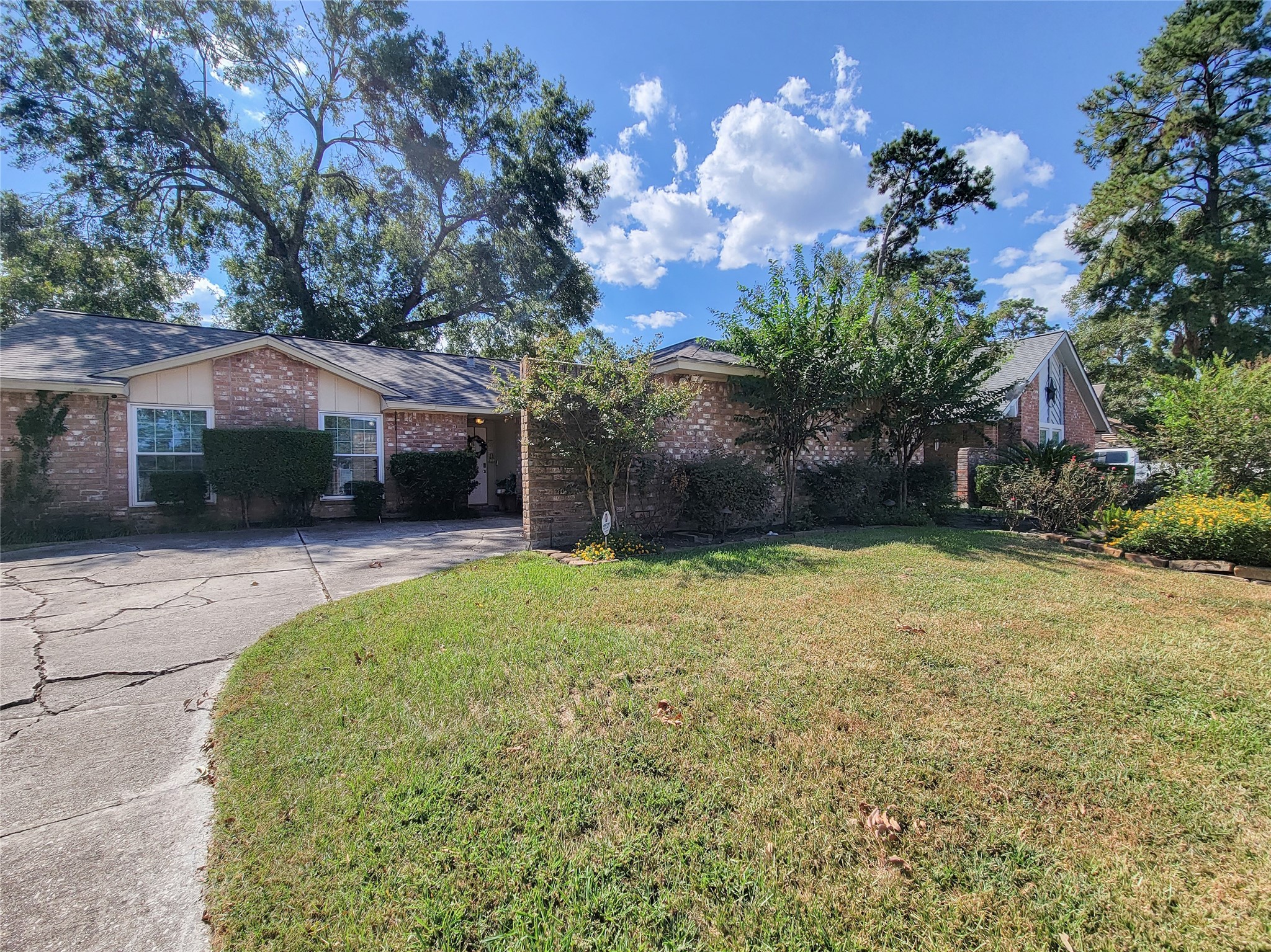 5414 Sweetwind Lane Spring, TX 77373 - Photo 3 of 30 a house view with a garden space