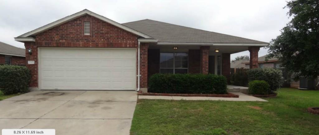 Ranch-style house with an attached garage, driveway, a porch, brick siding, and a front yard