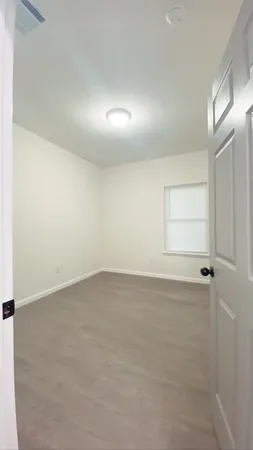 an empty room with a empty space and window
