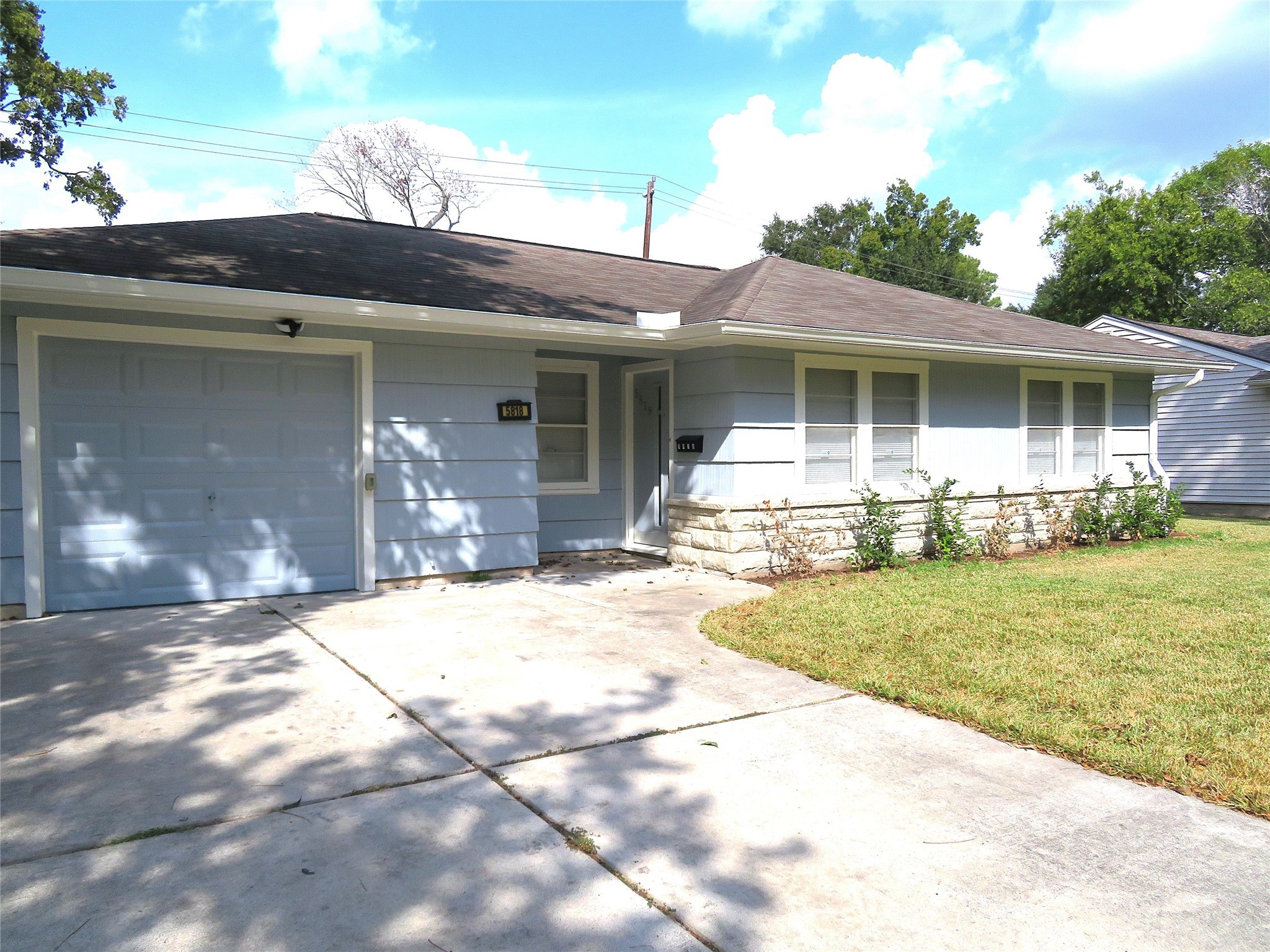 5818 Carew Street Houston, TX 77074 - Photo 2 of 16 a front view of a house with garden