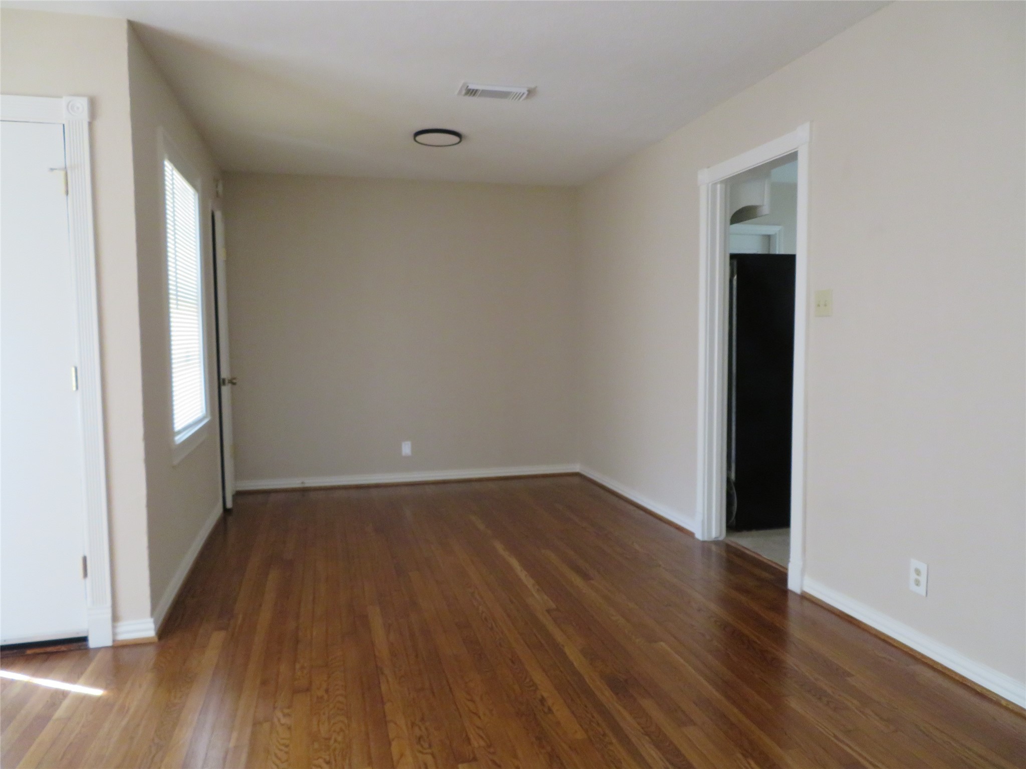 5818 Carew Street Houston, TX 77074 - Photo 3 of 16 an empty room with wooden floor and closet