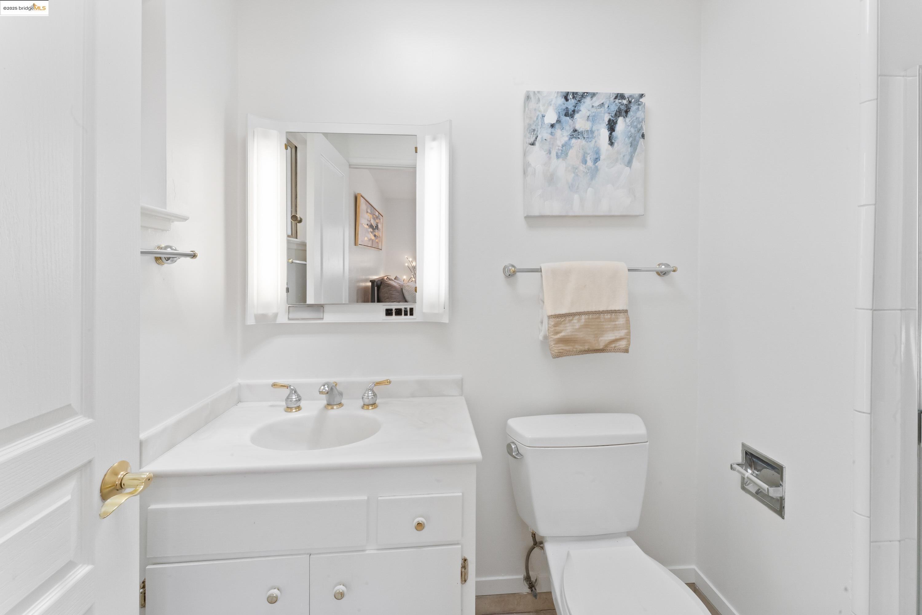 2305 Marlin Court Pinole, CA 94564 - Photo 15 of 31 a bathroom with a toilet sink and mirror