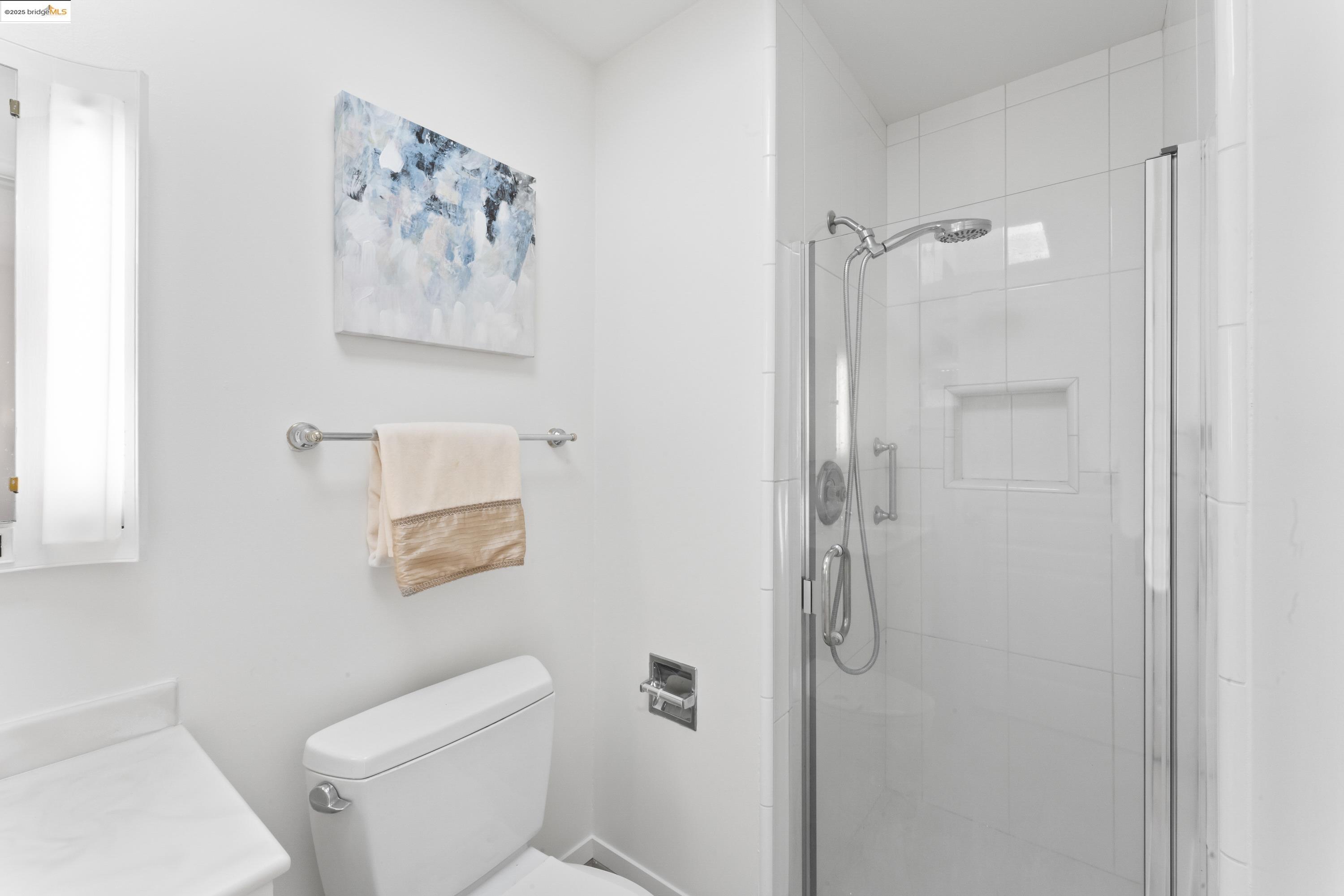 2305 Marlin Court Pinole, CA 94564 - Photo 16 of 31 a bathroom with a shower and toilet