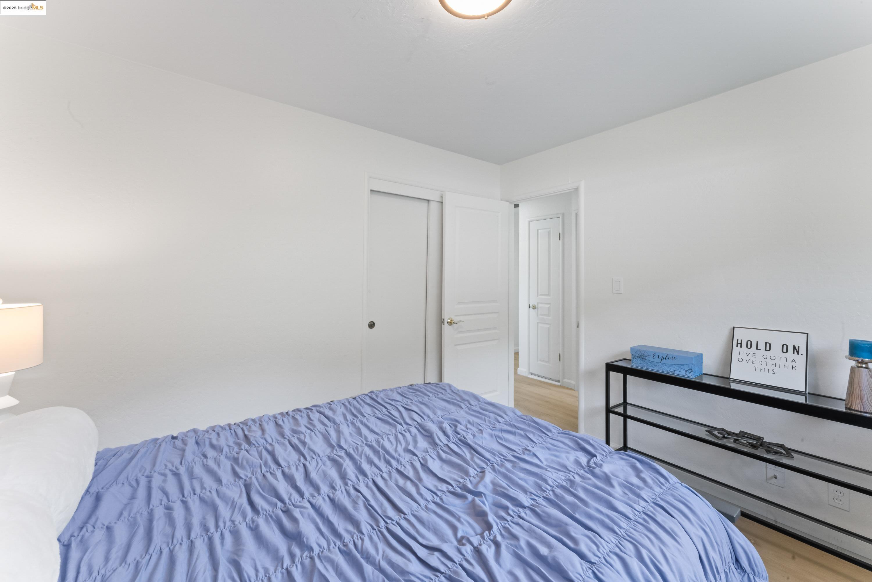 2305 Marlin Court Pinole, CA 94564 - Photo 18 of 31 a bedroom with a bed and wooden floor