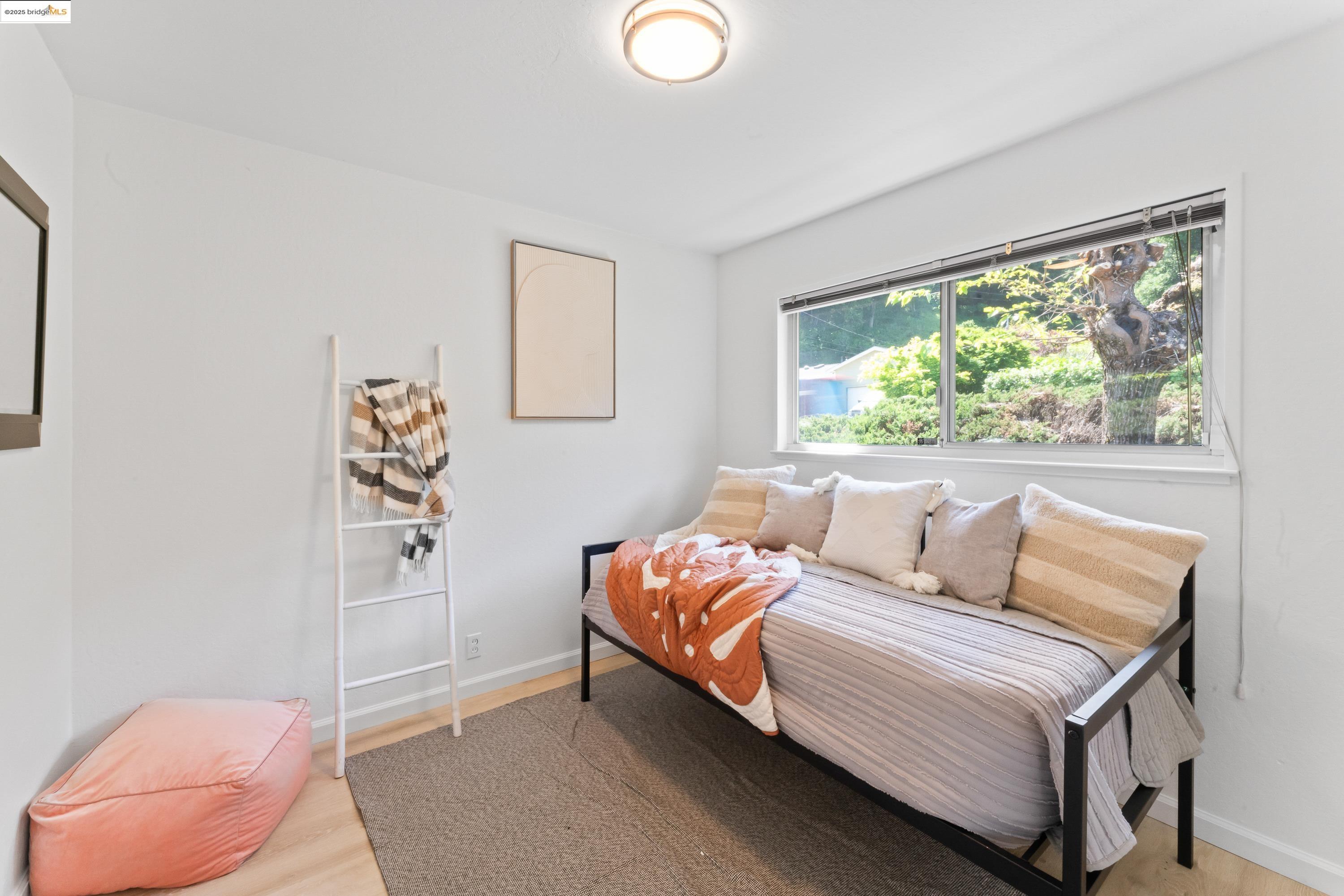 2305 Marlin Court Pinole, CA 94564 - Photo 19 of 31 a bedroom with a bed and a window