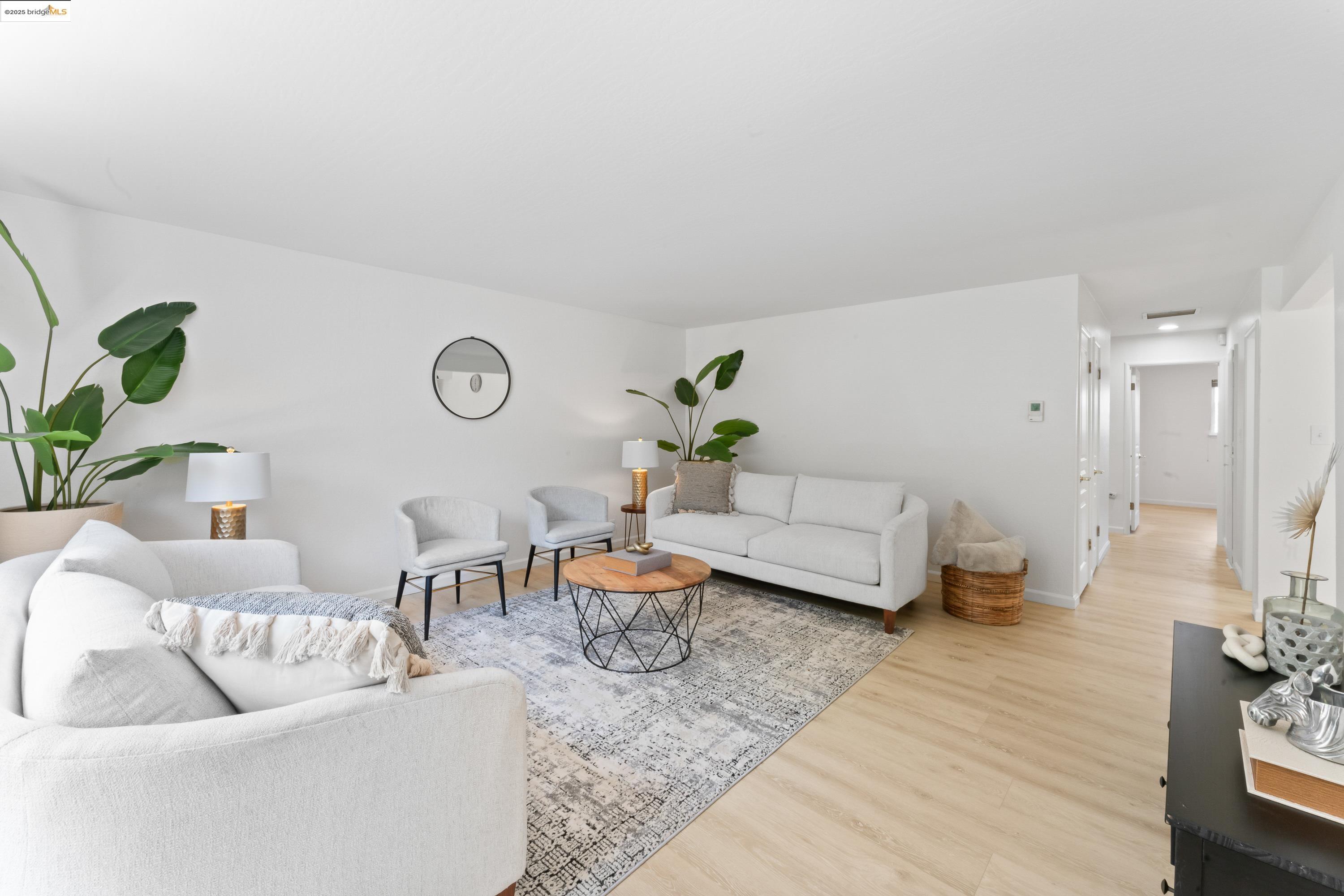 2305 Marlin Court Pinole, CA 94564 - Photo 2 of 31 a living room with furniture and a wooden floor