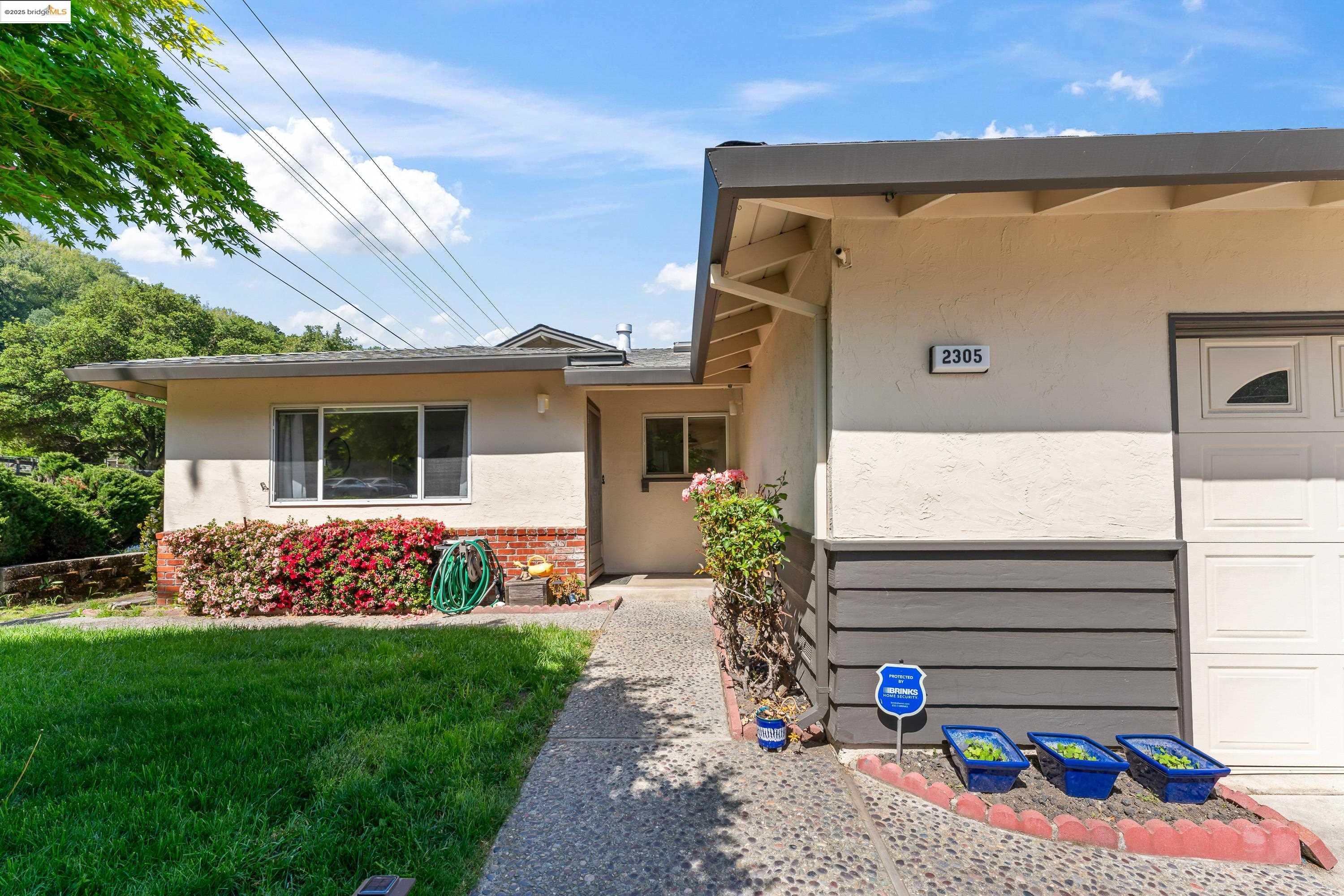 2305 Marlin Court Pinole, CA 94564 - Photo 25 of 31 a front view of a house with garden