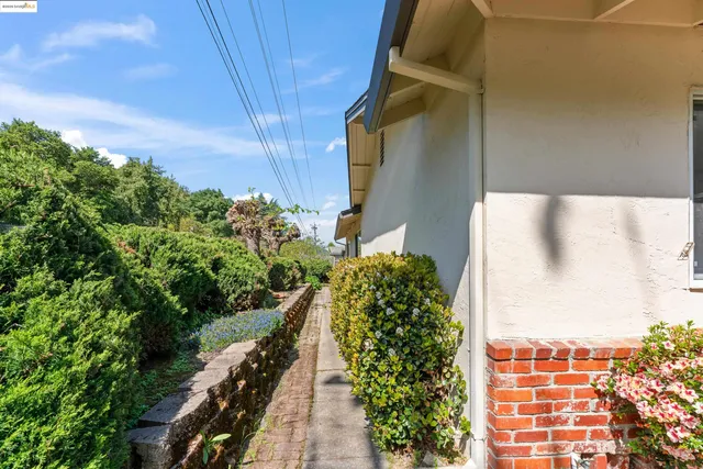 a patio with a table and chairs and a fire pit