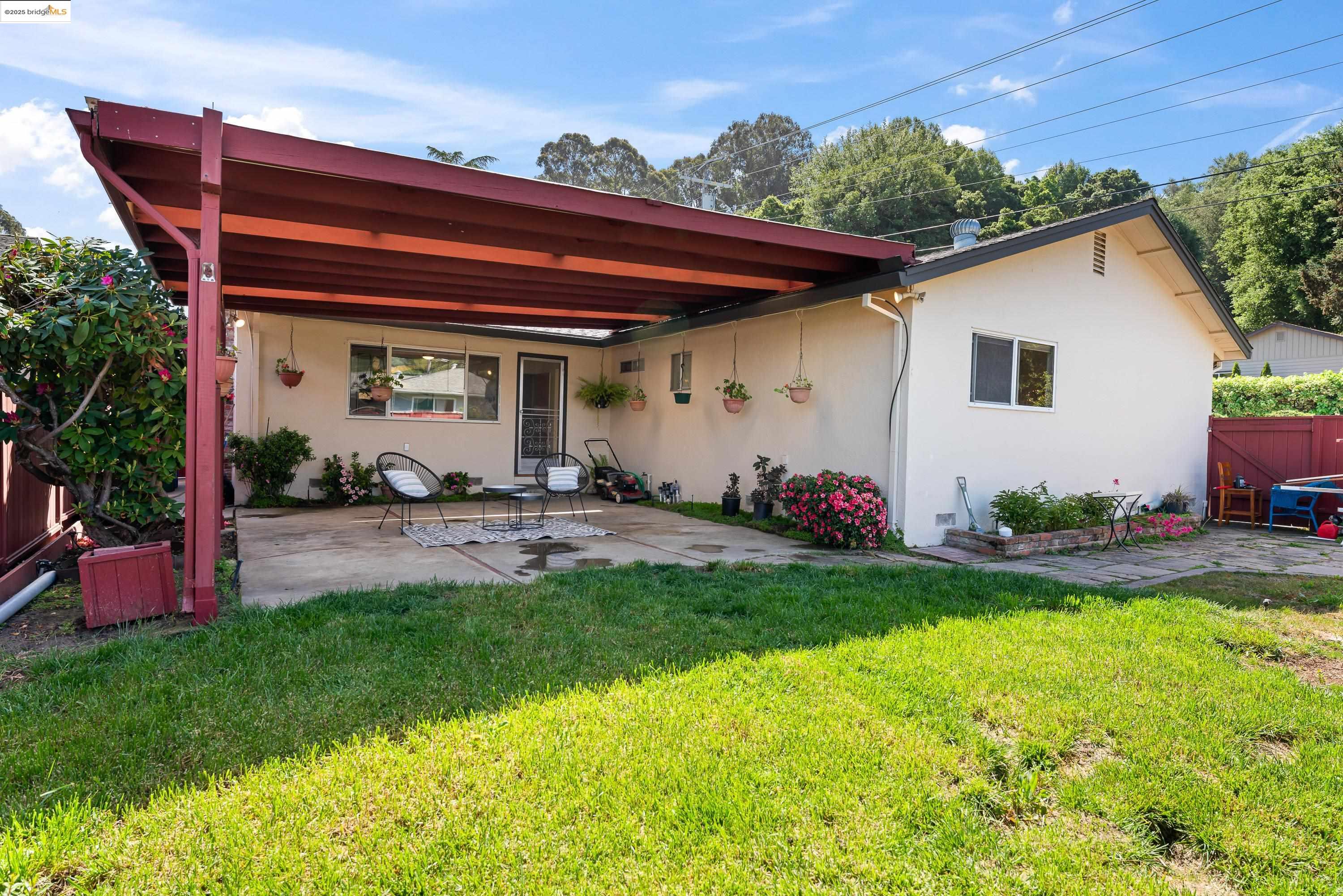 2305 Marlin Court Pinole, CA 94564 - Photo 28 of 31 a view of a backyard with plants and a patio