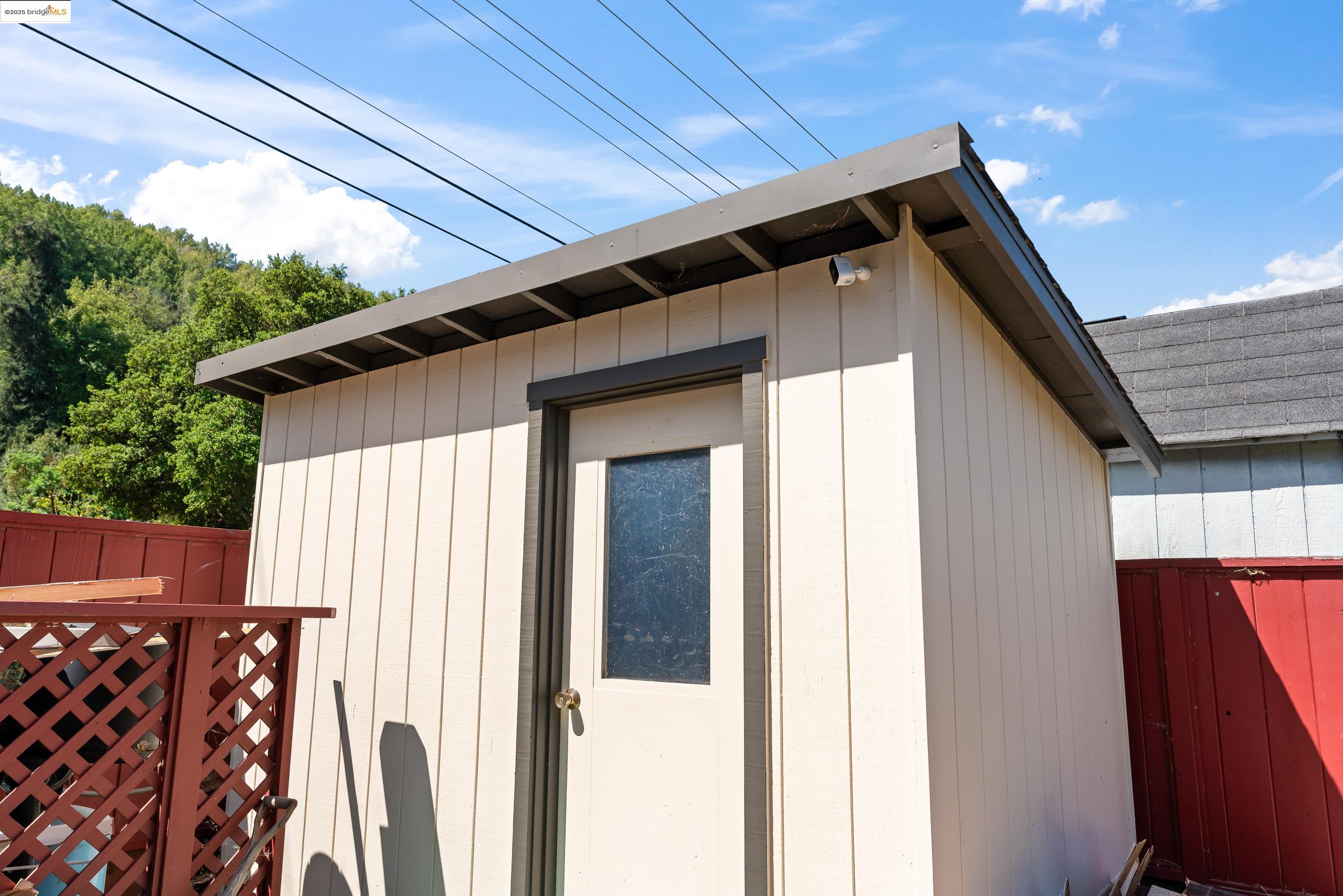 2305 Marlin Court Pinole, CA 94564 - Photo 30 of 31 a view of wooden house with a small yard