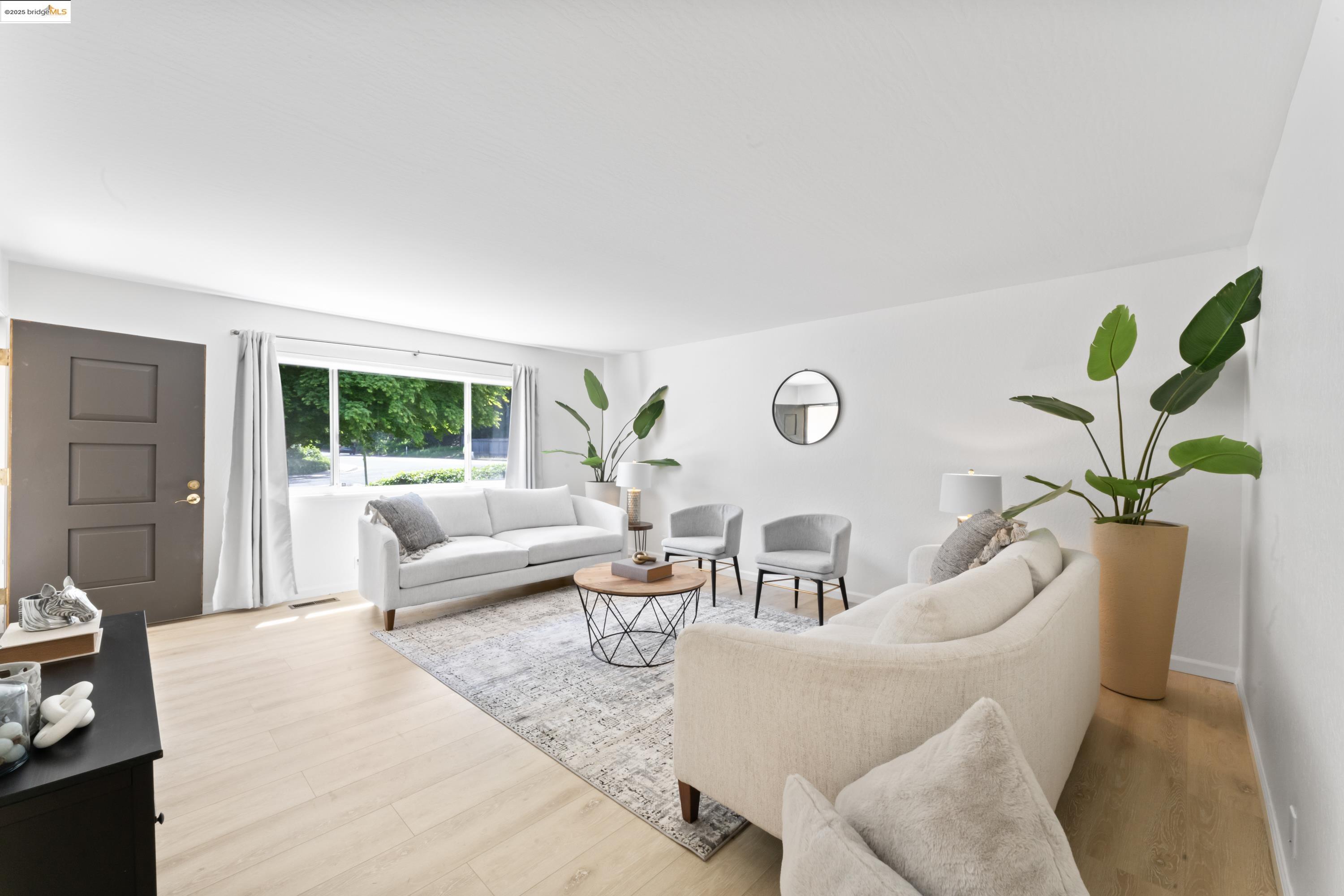 2305 Marlin Court Pinole, CA 94564 - Photo 4 of 31 a living room with furniture a rug and a window