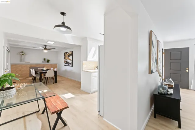 a dining room with furniture and window