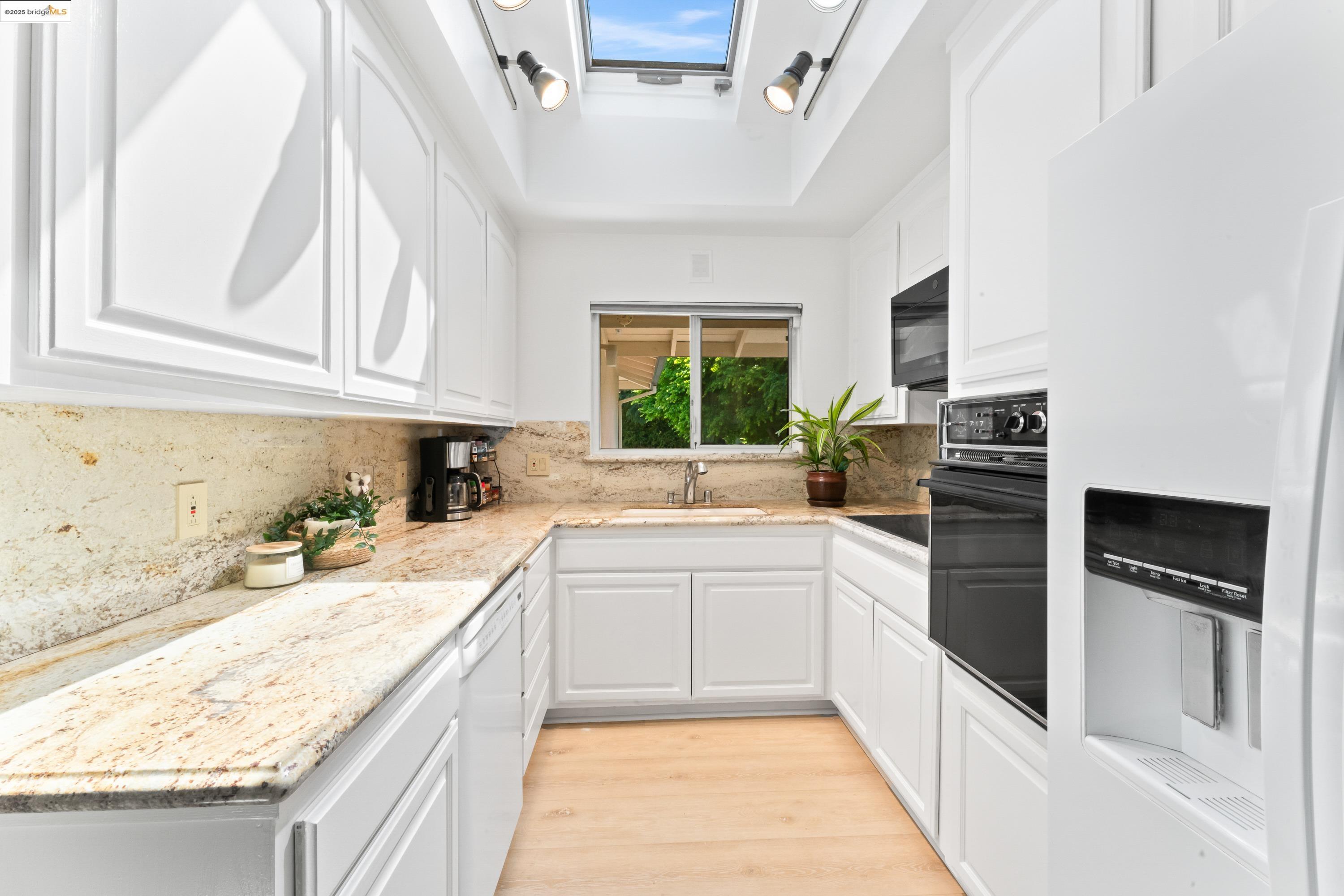 2305 Marlin Court Pinole, CA 94564 - Photo 7 of 31 a kitchen with stainless steel appliances granite countertop a refrigerator and a sink