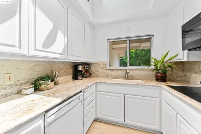 a kitchen with sink and window