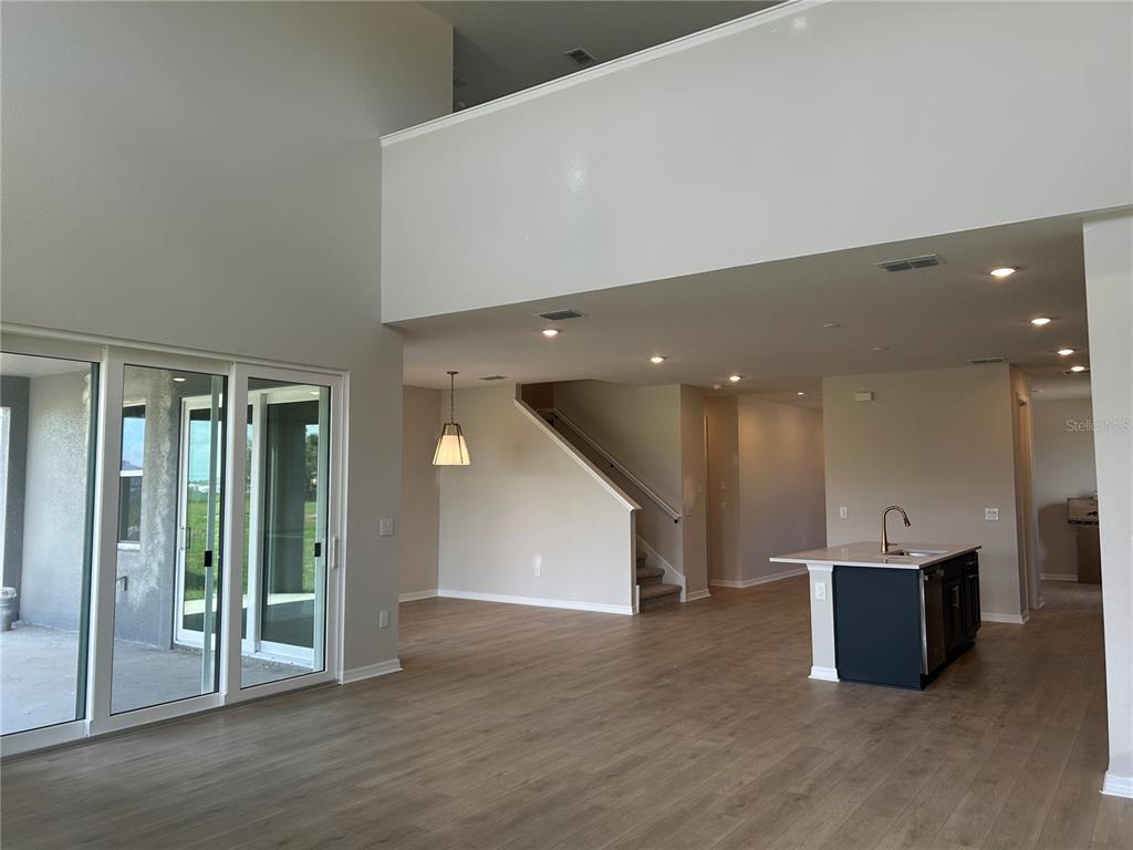 10026 Hidden Hammock Loop Parrish, FL 34221 - Photo 16 of 34 a view of a big room with entryway and hall view