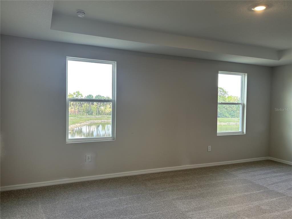 10026 Hidden Hammock Loop Parrish, FL 34221 - Photo 21 of 34 an empty room with a window