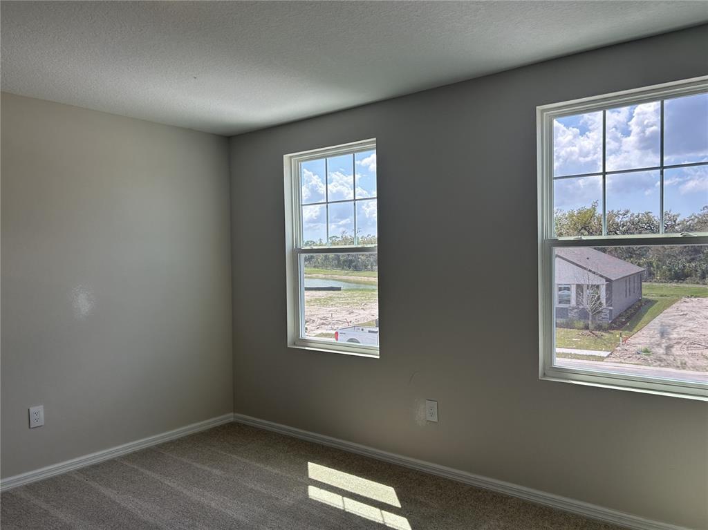 10026 Hidden Hammock Loop Parrish, FL 34221 - Photo 29 of 34 a view of an empty room with a window