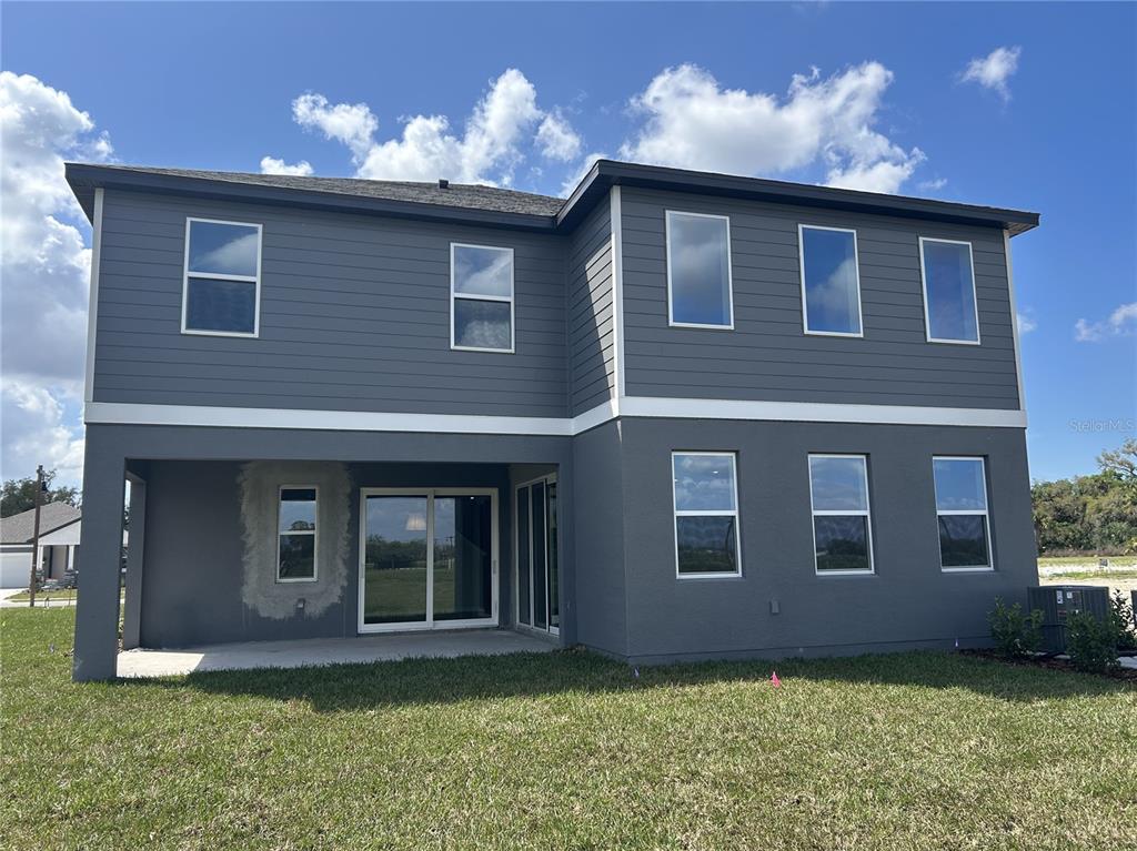 10026 Hidden Hammock Loop Parrish, FL 34221 - Photo 32 of 34 a front view of a house with a yard