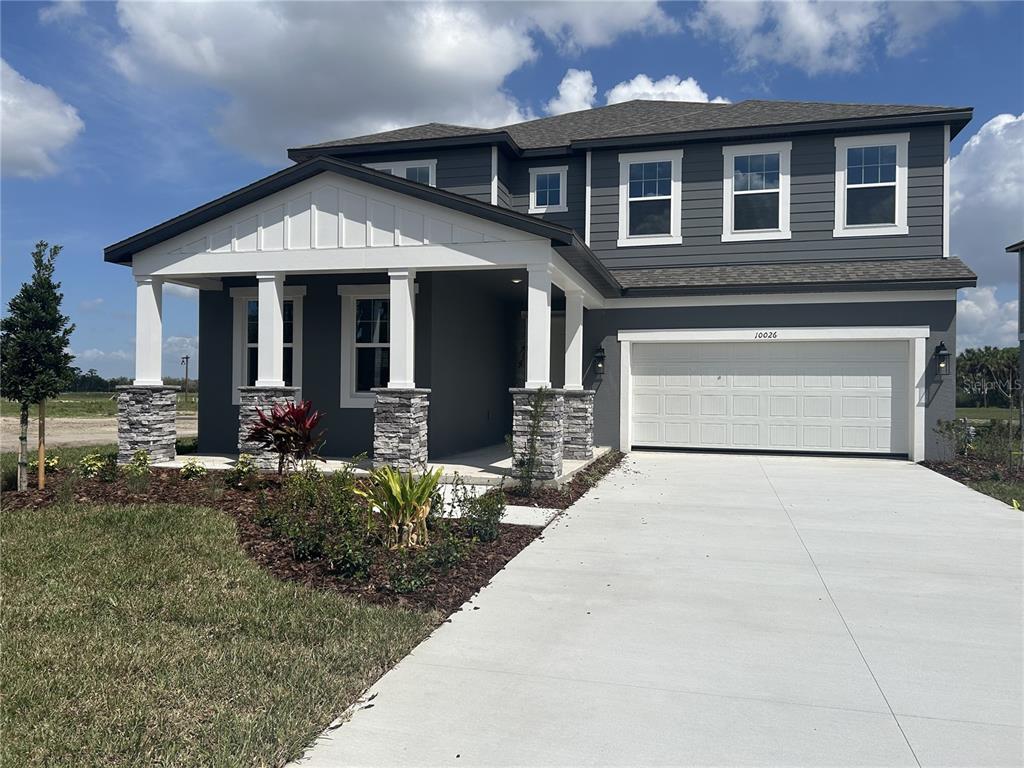10026 Hidden Hammock Loop Parrish, FL 34221 - Photo 5 of 34 a front view of a house with yard