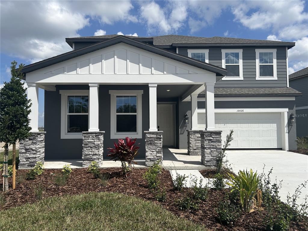 10026 Hidden Hammock Loop Parrish, FL 34221 - Photo 7 of 34 a front view of a house with sitting area