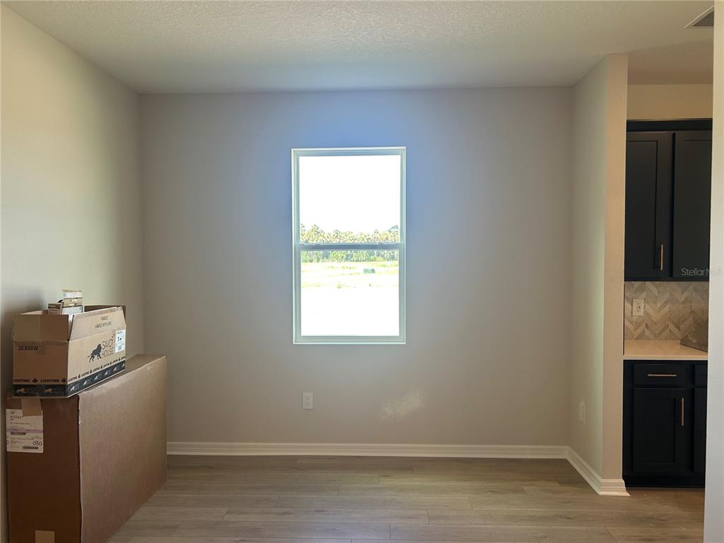 10026 Hidden Hammock Loop Parrish, FL 34221 - Photo 10 of 34 a room with storage and utility