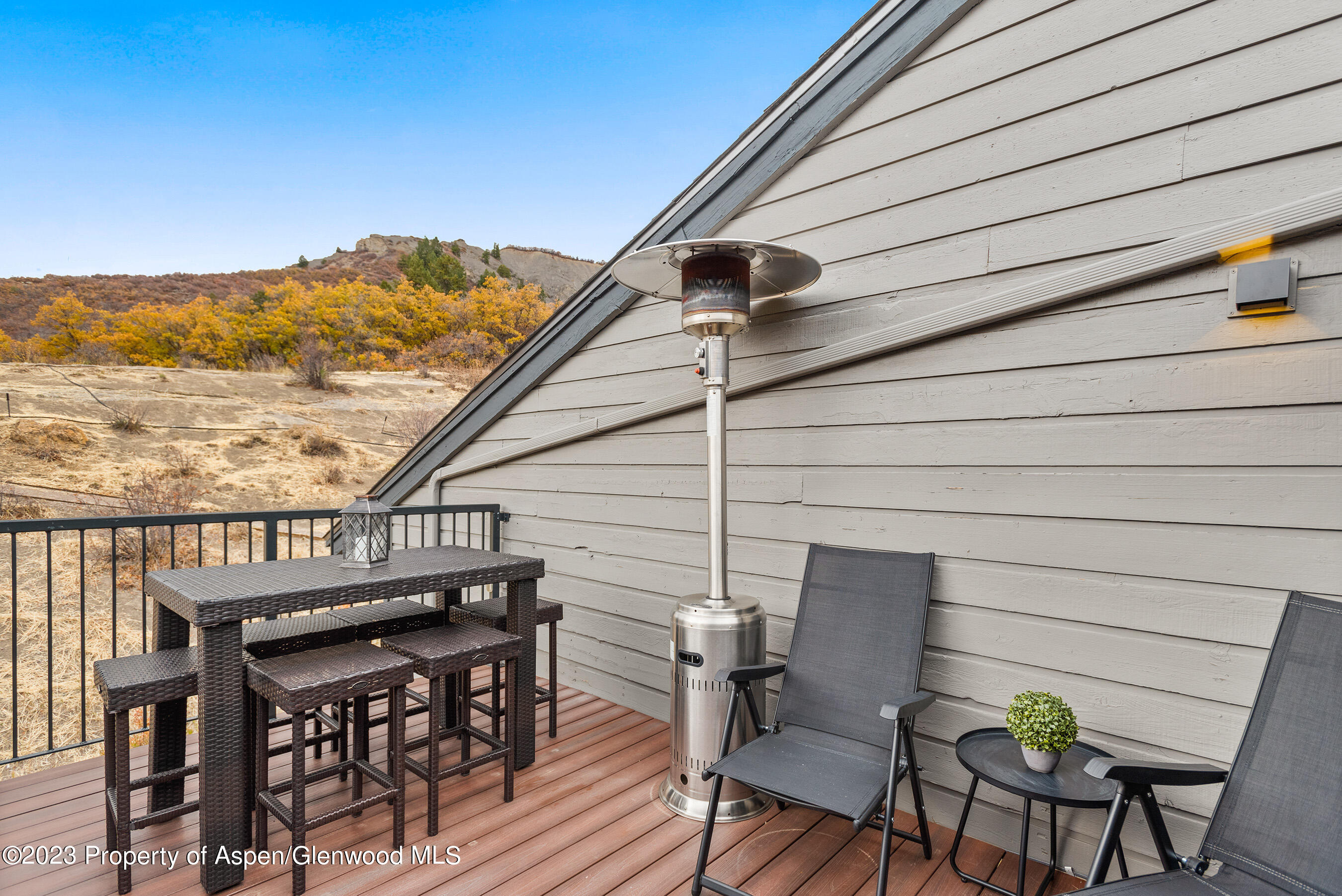 55 Upper Woodbridge Road, Unit G3 Snowmass Village, CO 81615 - Photo 29 of 44 a view of a terrace with furniture and stove