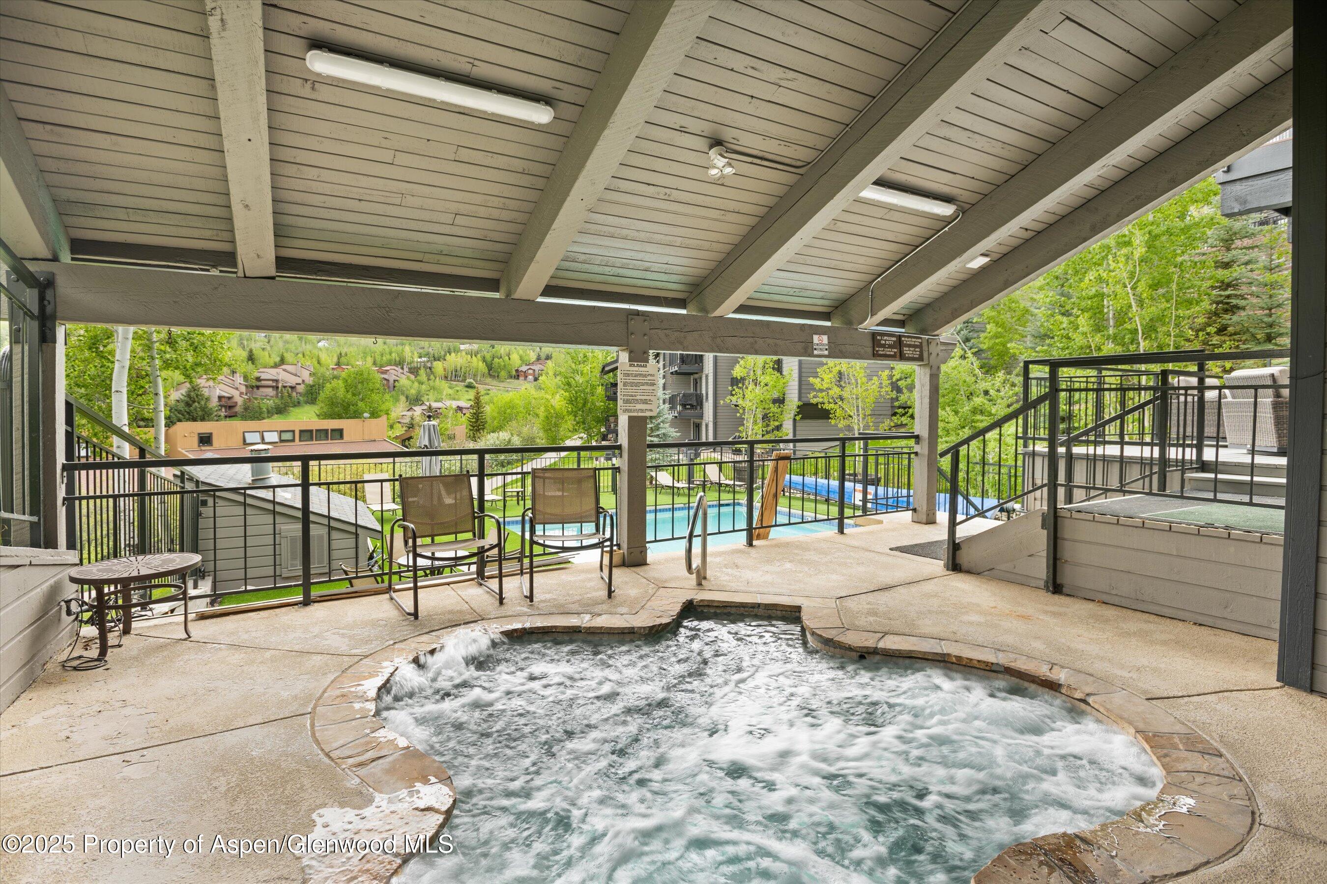 55 Upper Woodbridge Road, Unit G3 Snowmass Village, CO 81615 - Photo 43 of 44 a view of a swimming pool with an outdoor seating